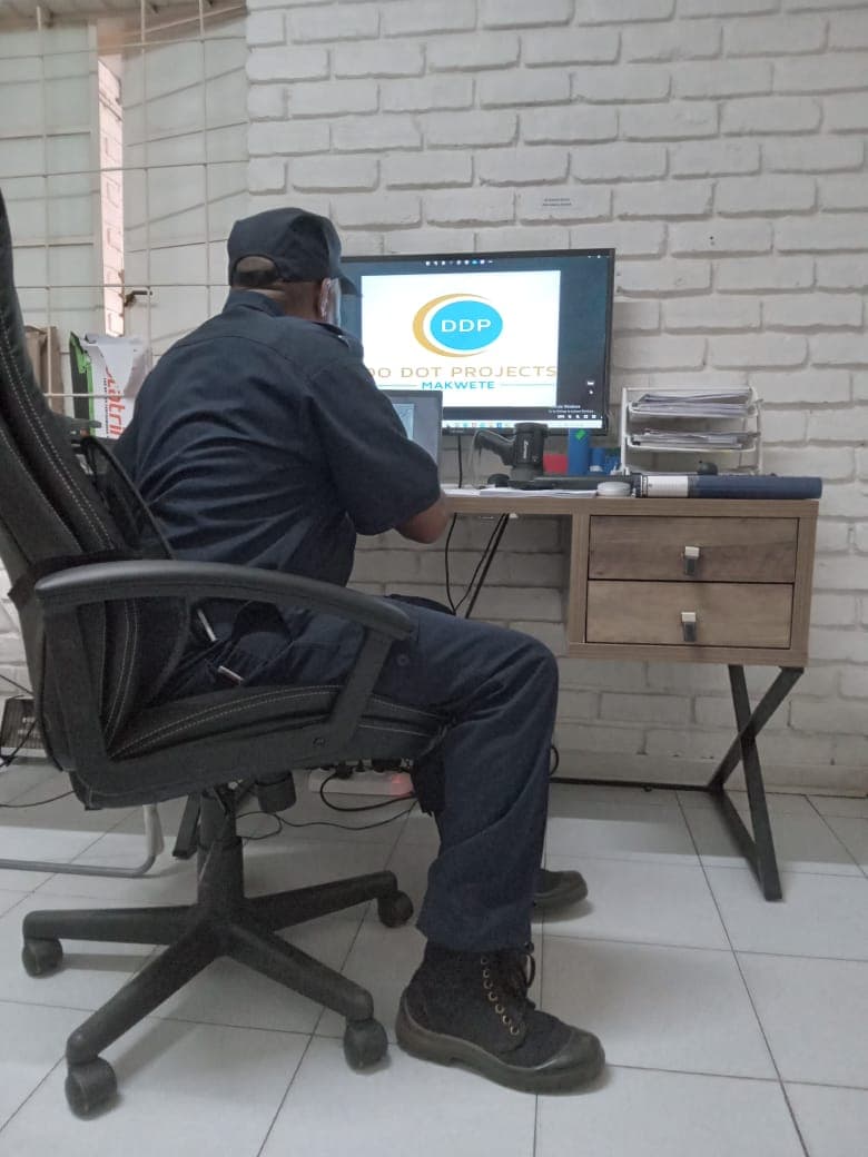 Officer working at computer monitoring station
