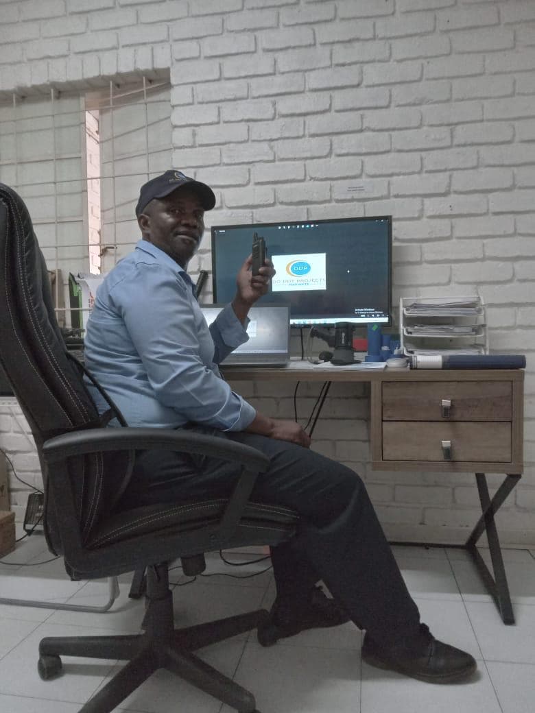 Security officer with radio at DDP office desk