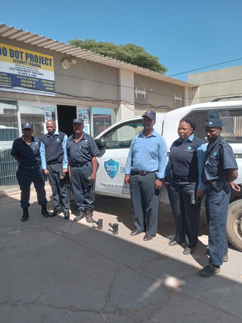 Six security officers with branded vehicle