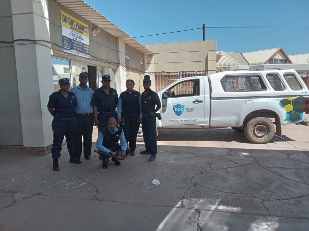 Do Dot Security team with vehicle at office
