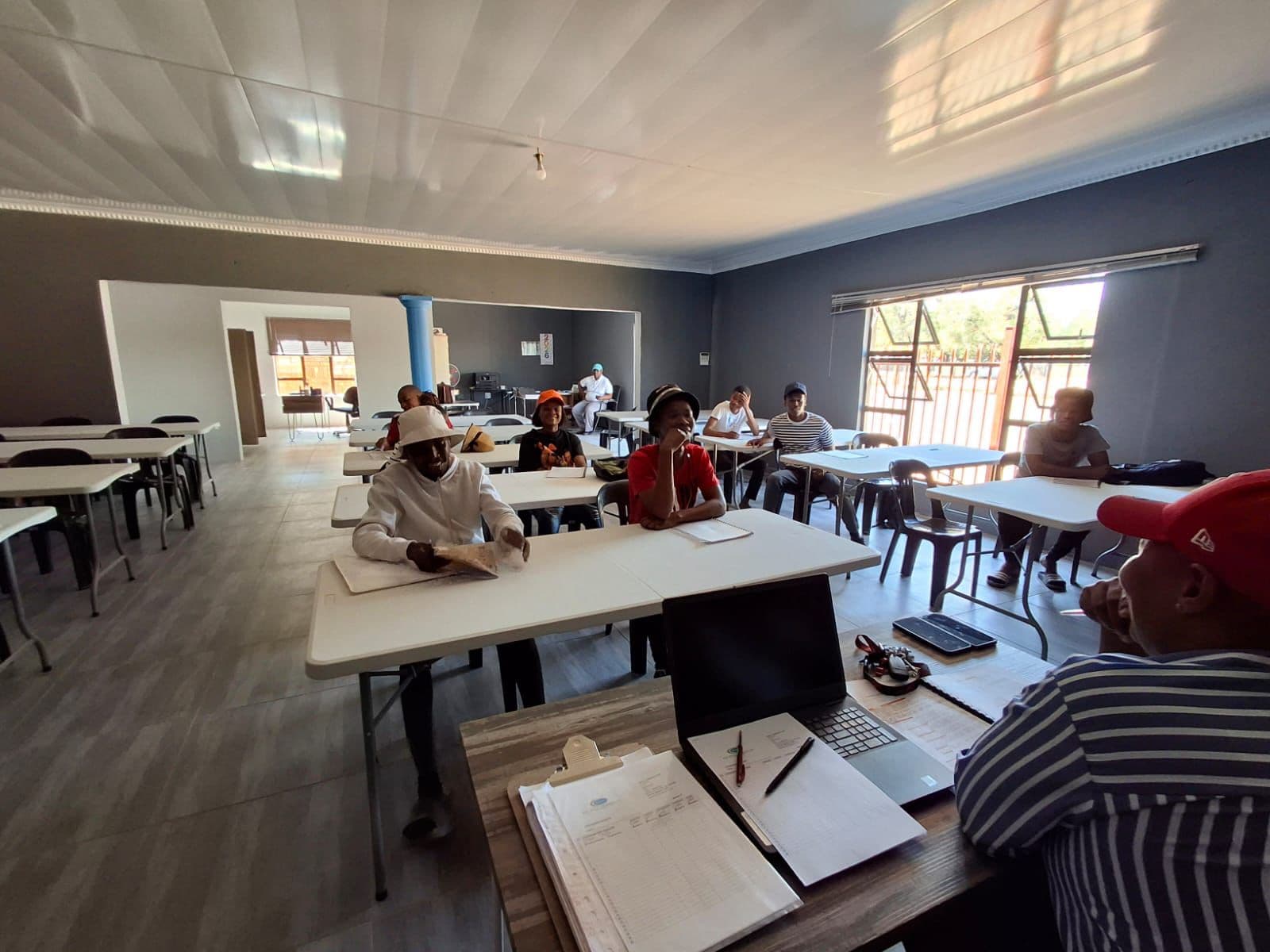 Wide view of students at desks during training